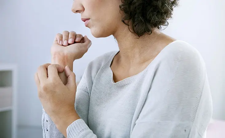 woman-scratching-itch-on-wrist